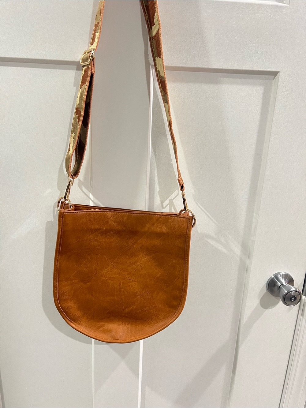 Ahdorned Leather-Textured Tan Crossbody Bag with Patterned Strap